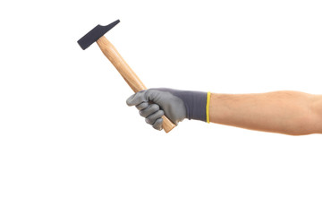 Gloved hand holding a hammer isolated on white background