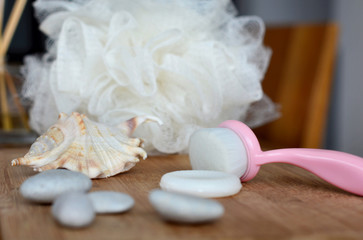 face cleaning brush, soap and sponge for spa procedures