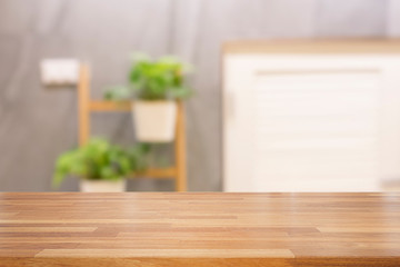 Empty wooden table with living room background