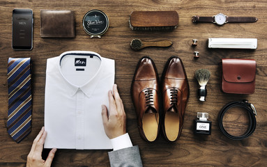 Businessman arranging his white shirt