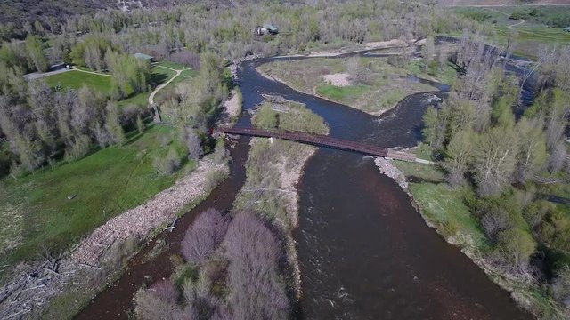 Aerial foot bridge over split river