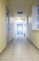 Empty long corridor in the modern office building. background