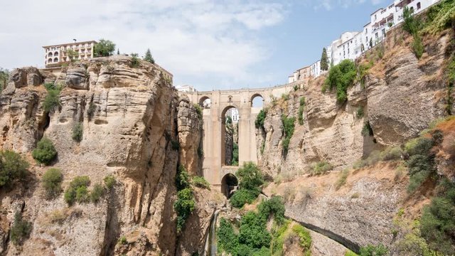 Beautiful timelapse view of Puente Nuevo bridge over Tajo Gorge in Ronda with tilt up camera motion, Andalusia, Spain