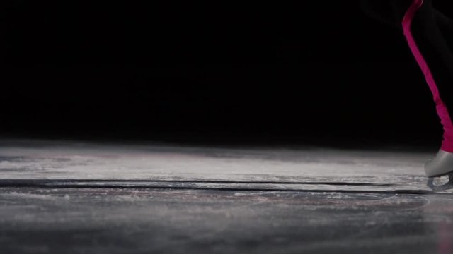 Close-up, legs in skates perform a jump and landing on the ice. Fragments scattered in different sitorons. Competitions in figure skating slow motion