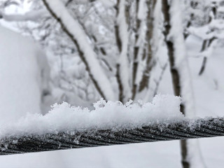 Steel cable covered with snow