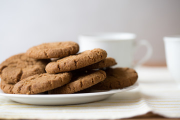 Healthy breakfast with oatmeal cookies or oatcakes and cup of tea or coffee