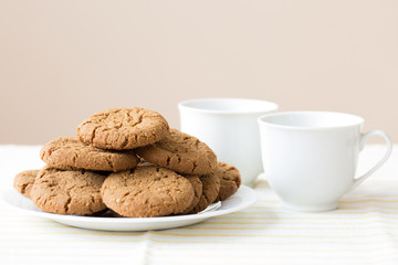 Healthy breakfast with oatmeal cookies or oatcakes and cup of tea or coffee