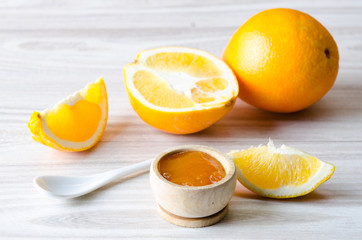 Orange jam served in spoon on the table