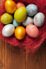 Fototapeta na wymiar Happy easter! Easter eggs on wooden background