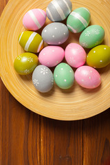 Fototapeta na wymiar Happy easter! Easter eggs on wooden background