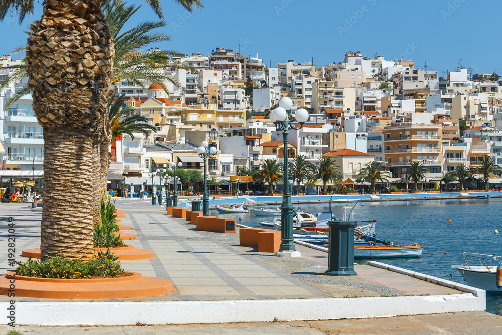 Wall mural Seaport of Sitia town with moored traditional Greek fishing boats