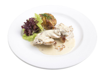 rabbit in white sause with baked potato.