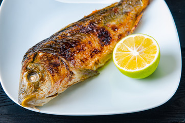 Fried fish served on the plate