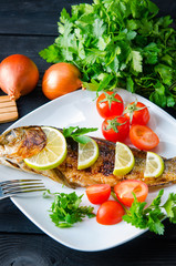 Fried fish served on the plate