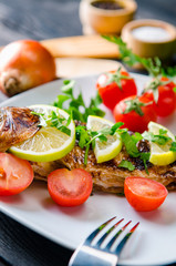 Fried fish served on the plate