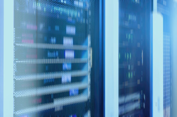 Web network, internet telecommunication technology, big data storage, cloud computing computer service business concept: server room interior in datacenter in blue light. 