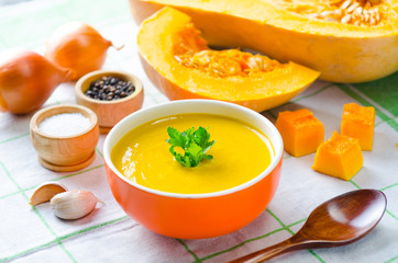 Pumpkin soup served on the table in bowl