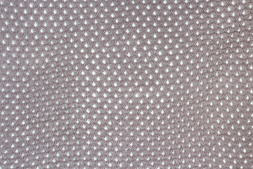 abstract knitted texture with holes of woolen fabric or textile cotton material