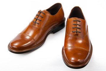 classic brown men's shoes on a white background