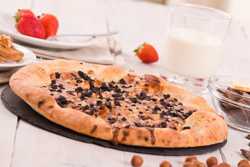 Sweet chocolate pizza with cookies. 