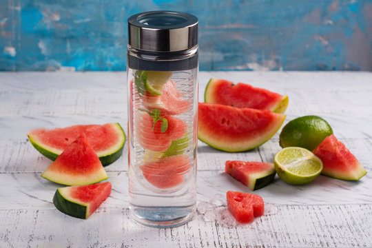 Homemade watermelon detox infused water on wooden background