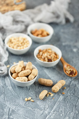 Different nuts on gray background