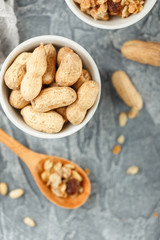 Different nuts on gray background