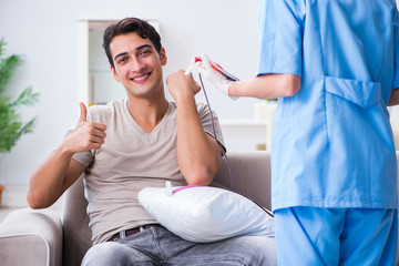 Patient getting blood transfusion in hospital clinic