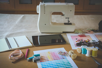 equipment on fashion designer desk in studio. design thing in atelier
