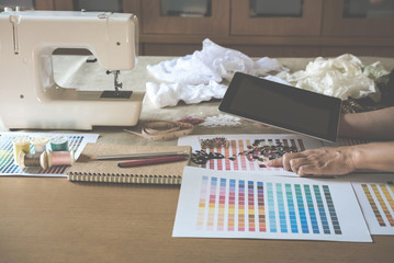 equipment on fashion designer working in studio with equipment on desk. design thing in atelier