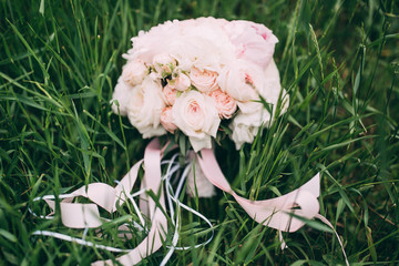 Wedding bouquet on green grass