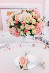 Wedding bouquet on the table with cutlery