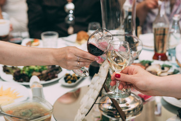 Red and white wine. Wine in glasses. Wedding table.