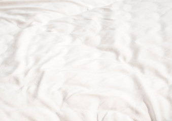 Abstract wrinkles white dust mites bedding cover, fabric or textile texture, pattern and background.