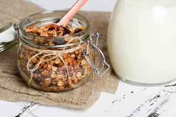 Homemade granola with nuts, cranberries and dried apricots, selective focus, copy space