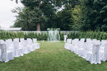 Wedding arch on a green glade.
