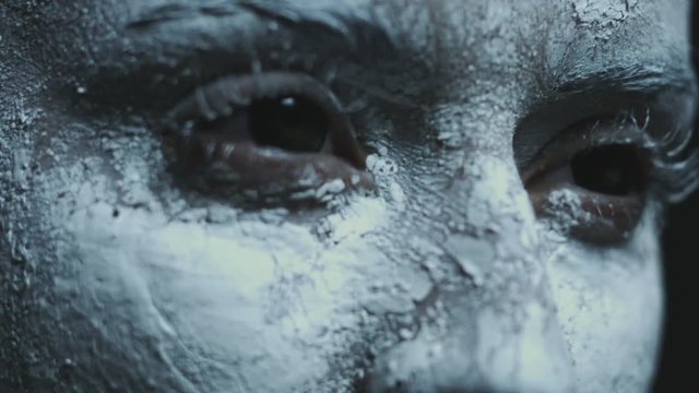 demonic witch with black eyes dancing