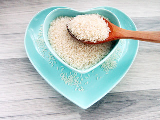 on wood floors hearted bowl of rice,food,pulses 