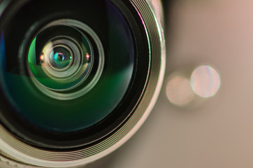 The camera lens and light gray . Horizontal photo