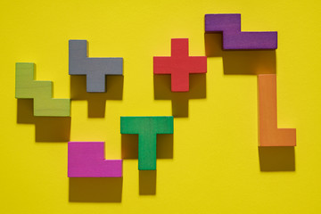 Obraz premium Abstract geometric background, colorful logic game. Isometric game blocks on yellow background. Pop art style design. Logical concept.