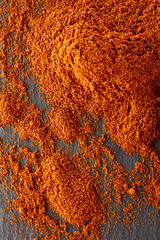 Texture background. Red chilli pepper powder. Top view