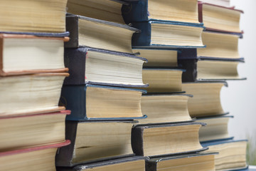 Stack of books background. many books piles.