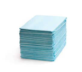Stack  of disposable bed pads isolated on white - obrazy, fototapety, plakaty