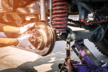 The front wheel of the car was removed to repair the brake system, Automotive industry and garage concepts.