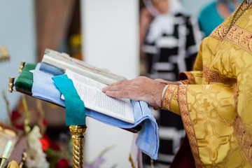 priest says a prayer in the church