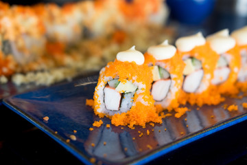 Roll sushi with shrimp orange eggs