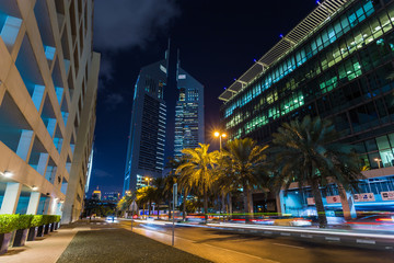 Fototapeta na wymiar Emirates Towers at night time, Financial center of Dubai, UAE.