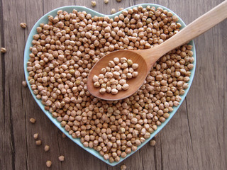 hearted chickpeas in bowl on the wooden floor.food,chickpeas,pulses 