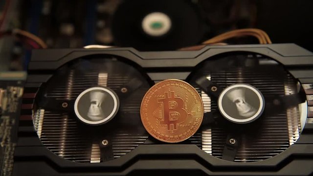 An abstract image of the mining Bitcoin with a computer graphics card fan