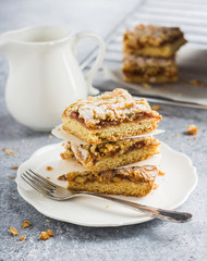 Sweet piece of cake pie with fruit jam and streusel in white plate